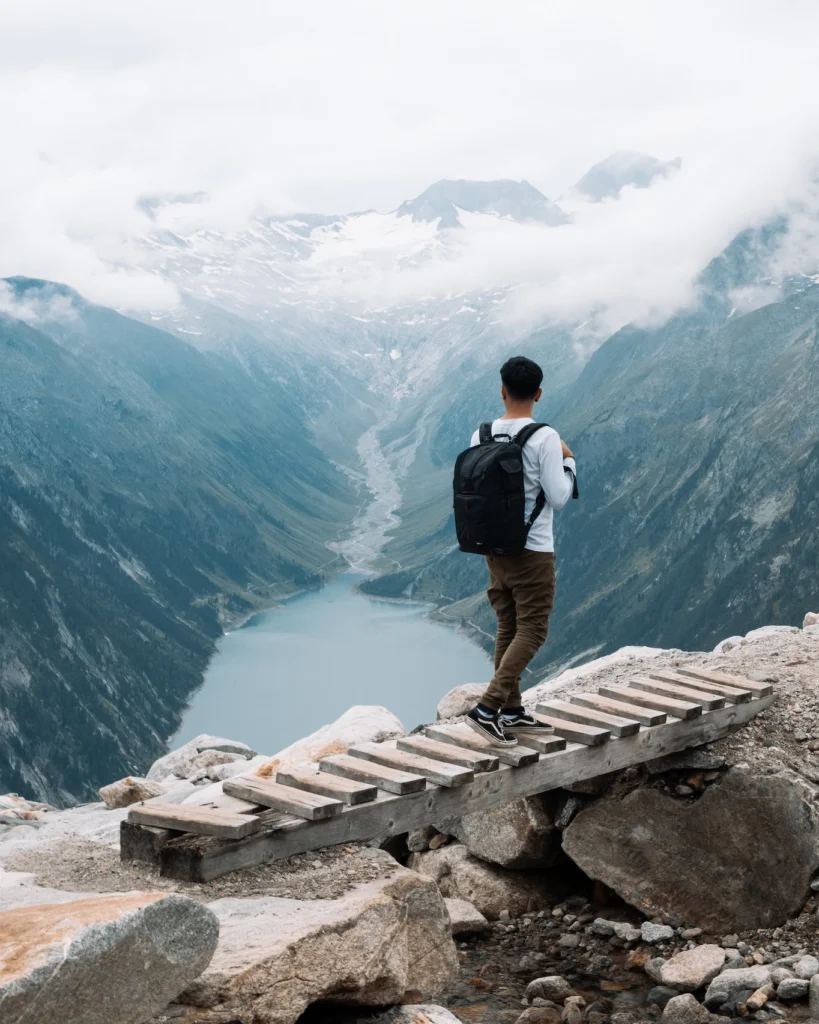 Man on wooden bridge hiking